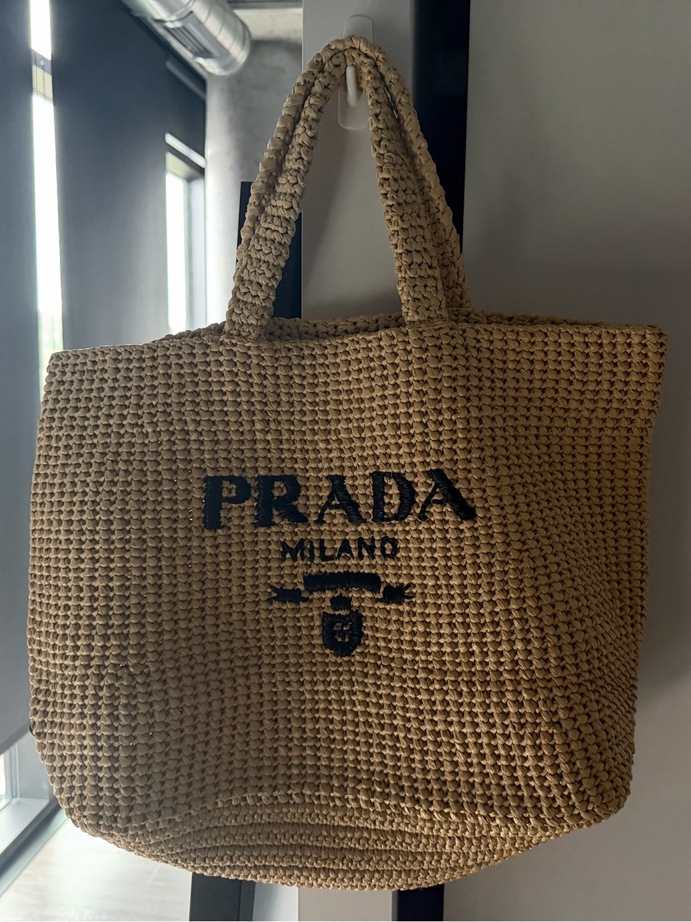 Prada woven raffia tote in tan with black logo